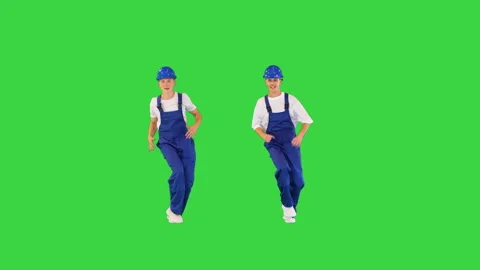 Two construction workers greet each other and dance in sync doing thumb up Stock Footage 219464858