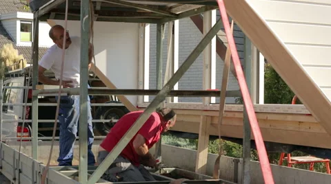 Two construction workers working on a construction Stock Footage 41813300