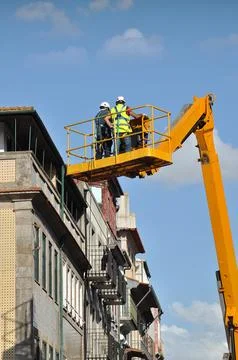 Two construction workers working Stock Photos