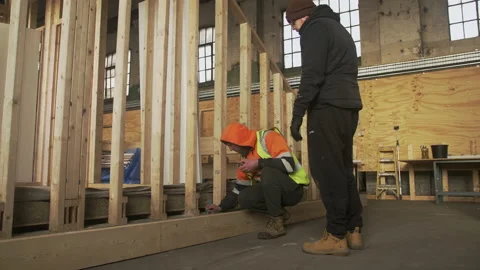 Two construction workers working on wooden frame, Mansfield, England, UK 스톡 동영상 155058811