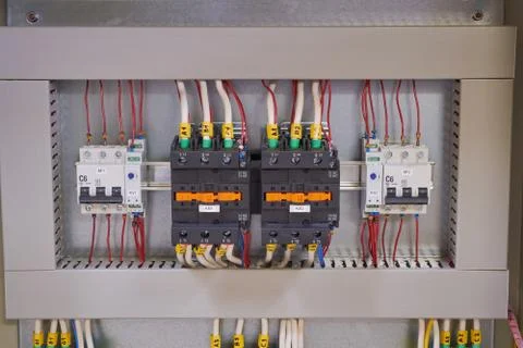 Two contactors, two circuit breakers and two phase control relays. Stock Photos