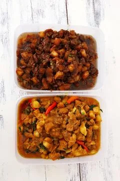 Two containers of vegetable curry with colorful vegetables Stock Photos