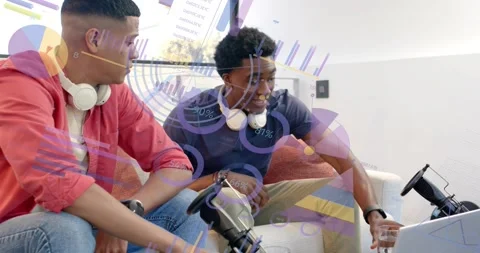 Two content creators pressing gaming wheel button and discussing strategies with Stock Footage 318173608