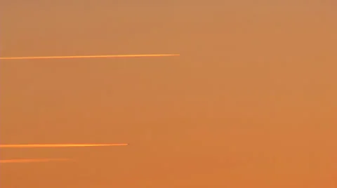 Two contrails in an orange evening sky 動画素材 39437169