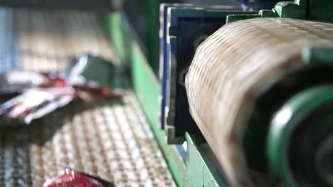 Two conveyor stripes on a tomato processing plant with falling ketchup packages Stock Footage 118294772