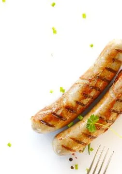 Two cooked sausages side by side against white Stock Photos
