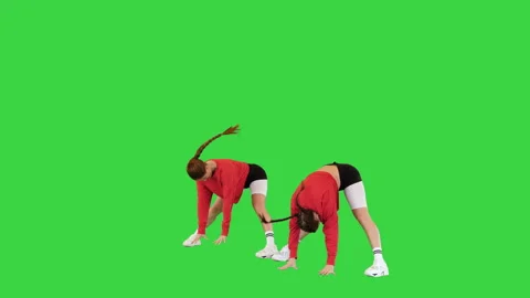 Two cool b-girls dancing synchronously on a Green Screen, Chroma Key. Stock Footage 218096941
