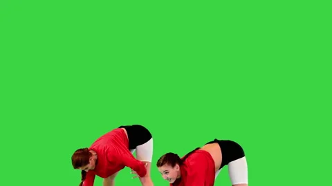 Two cool b-girls dancing synchronously on a Green Screen, Chroma Key. Stock Footage 219235443