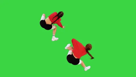 Two cool b-girls dancing synchronously on a Green Screen, Chroma Key. Stock Footage 219237264