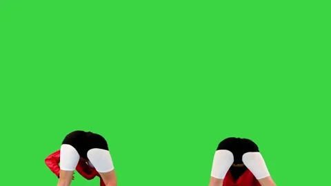 Two cool b-girls dancing synchronously on a Green Screen, Chroma Key. Stock Footage 219470072
