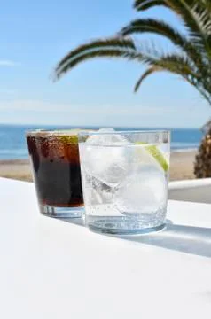 Two cool ice drink on a beach Stock Photos