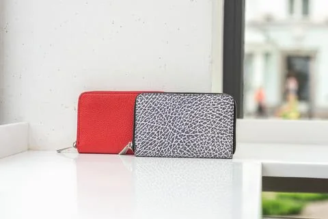 Two cool wallets on the white table Stock Photos