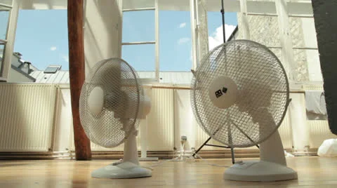 Two cooling fans inside on a hot summer day Stock Footage 26755905
