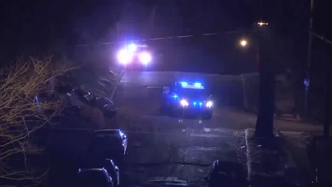 TWO COP CARS AT NIGHT IN THE RAIN WITH L... | Stock Video | Pond5