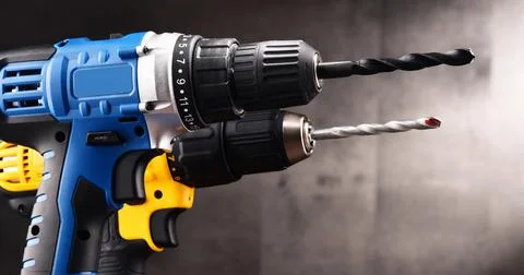 Two cordless drills with drill bits working also as screw guns. Stock Photos