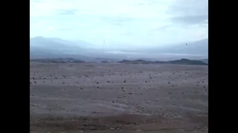Two corny pioneers on the American frontier are frightened by a group of Native Stock Footage