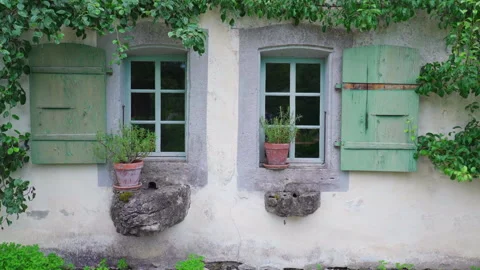 Two cottage windows, old-fashioned traditional architecture in rural reside.. Stock Footage 249629651
