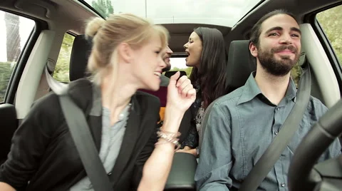 Two couple in love in car going in vacation kissing and dancing happy Stock Footage 58866867