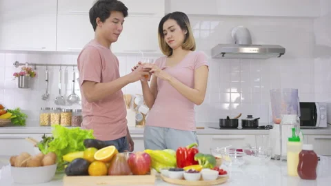 Two couple young asian drinking vegetarians fresh smoothie and smile enjoy life Stock Footage 147372213