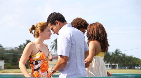 Two couples dancing on pier Stock Footage 38760718