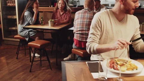 Two couples having diner at restaurant. Couples sharing food. Stock Footage 125080651