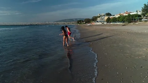 two couples having fun on sandy beach sh... | Stock Video | Pond5