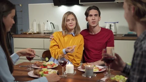 Two couples laughing at dinner Video stock 114811250