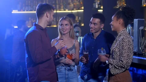 Two couples in love dating in bar clinking glasses Video stock 105541430
