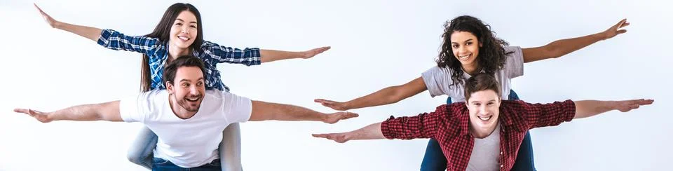 The two couples playing on the white background Stock Photos