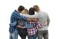 The two couples stand and hug on the white background Photo