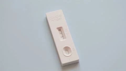 Two Covid-19 antigen rapid test devices tests, side by side on blue background Stock-Footage 170607928