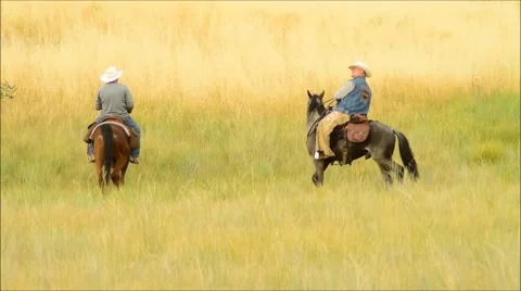 Two Cowboys Riding off Stock Footage 52372503