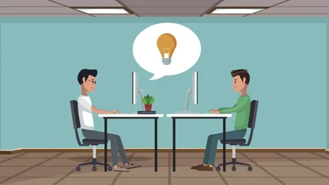 Two coworkers collaborating on a project inside an office with light bulb i.. Stockbeeldmateriaal 339072369