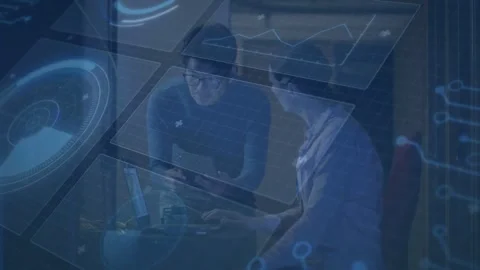 Two coworkers debugging code at desk, right person touching laptop trackpad Stock Footage 333904996
