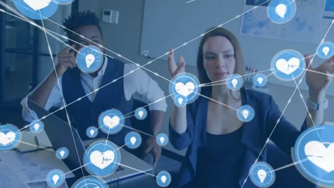 Two coworkers gesturing as heart icon popping over hands, tapping nodes, network Stock Footage 329904594