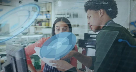 Two coworkers gesturing sheet activating rotating radial chart aligning paper Stock Footage 315544005
