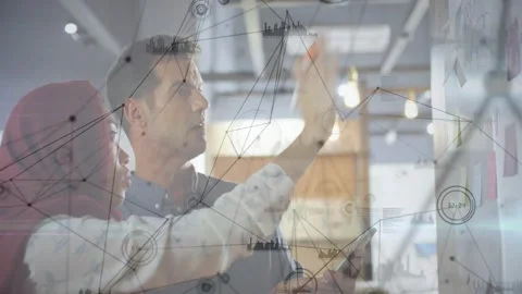 Two coworkers placing note checking phone sorting notes planning with faint Stock Footage 329909821