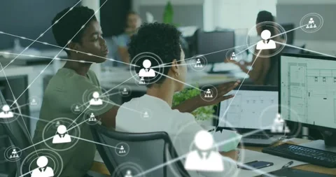 Two coworkers at screen opening office app, creating expanding node overlay over Stock Footage 321161434