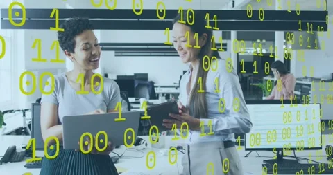 Two coworkers tapping tablet and reviewing technology data on laptop at office Stock Footage 327063816