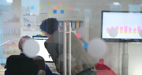 Two coworkers working on web design of online store Stock Footage 99231131
