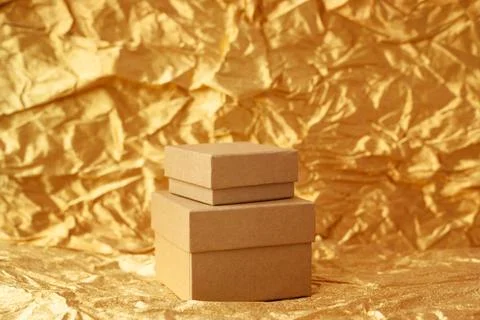Two craft boxes in retro style on golden christmas background. Stock Photos