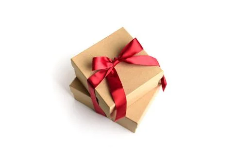 Two craft gift boxes with red ribbon bow. Stock Photos