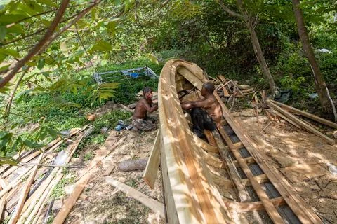 Two Craftsmen Construct Thai Long-Tail Boat in Krabi Stock Photos