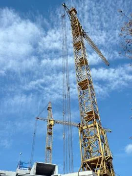 Two crane towers on sky background 库存照片