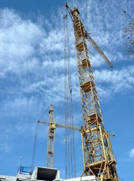 Two crane towers on sky background 库存照片