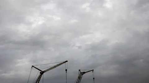 Two cranes and gloomy clouds in timelapse Stock Footage 62481723