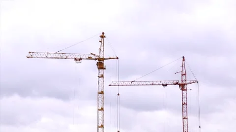 Two cranes on the background of the sky with clouds. Stock Footage 255025366
