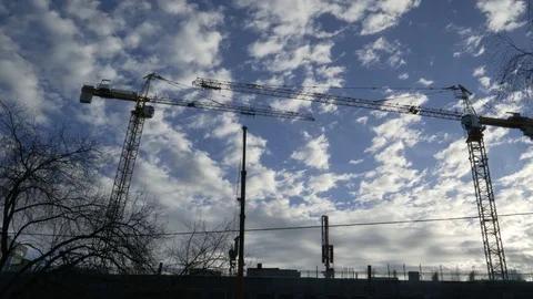 Two cranes at the construction site Stock Footage 105013711