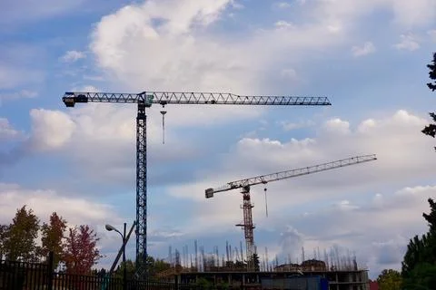 Two cranes at the construction site. Stock Photos