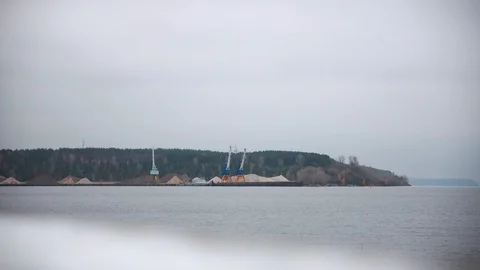 Two cranes excavators load sand into a barge. Timelaps. Stock Footage 120465859